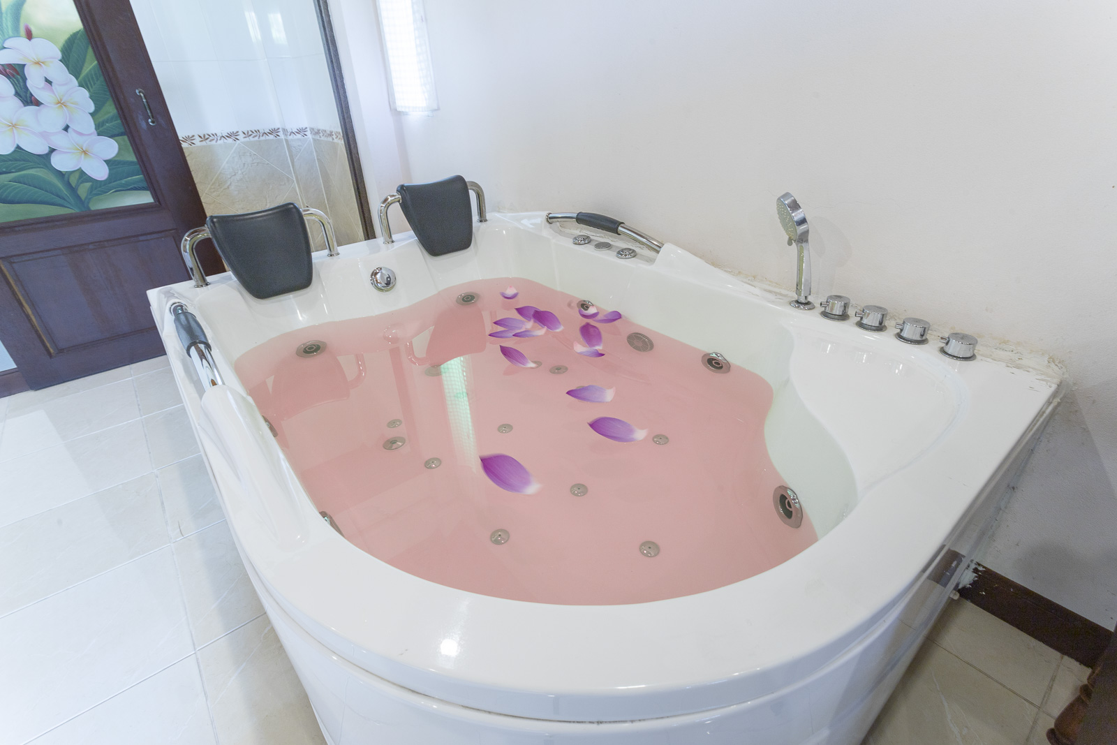 Whirlpool bath with flower petals