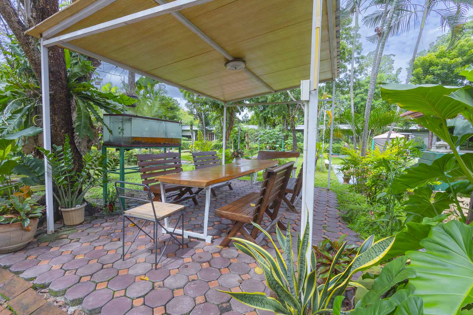 Shaded outdoor dining table in the resort garden